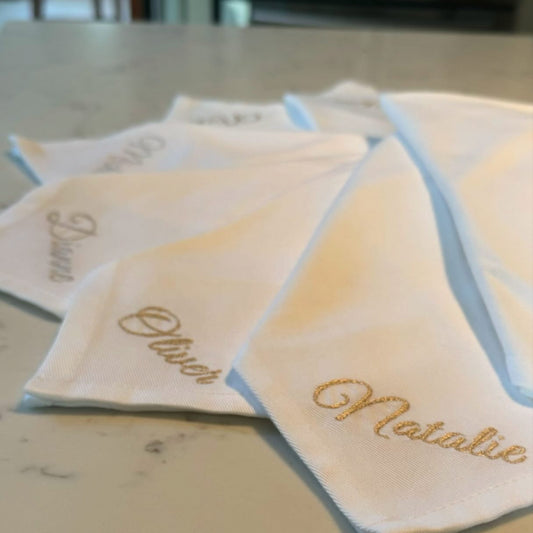 Set of personalized handkerchiefs on a marble surface